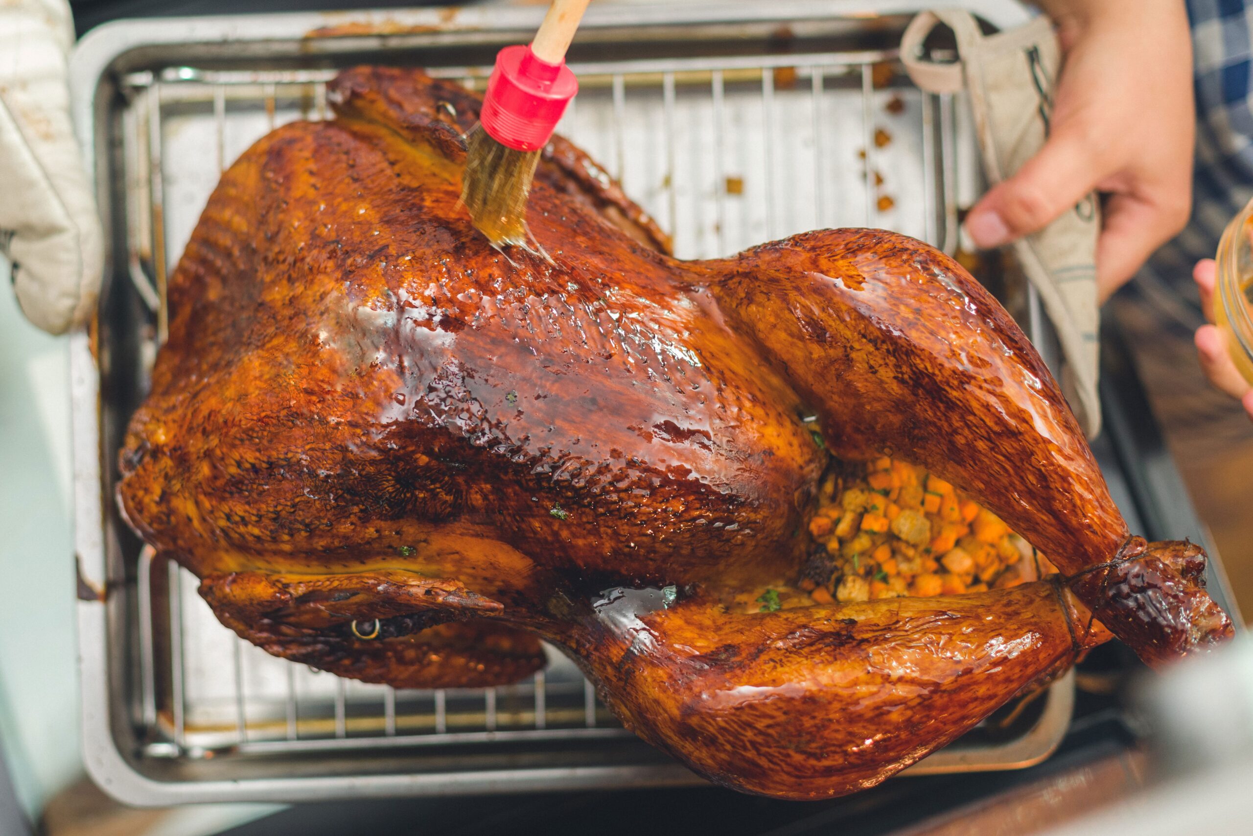 The art of turkey basting: a culinary tradition that divides families and sparks fierce debates over the true path to holiday feasting glory, reminiscent of the age-old conflicts that have shaped our shared history and culture.