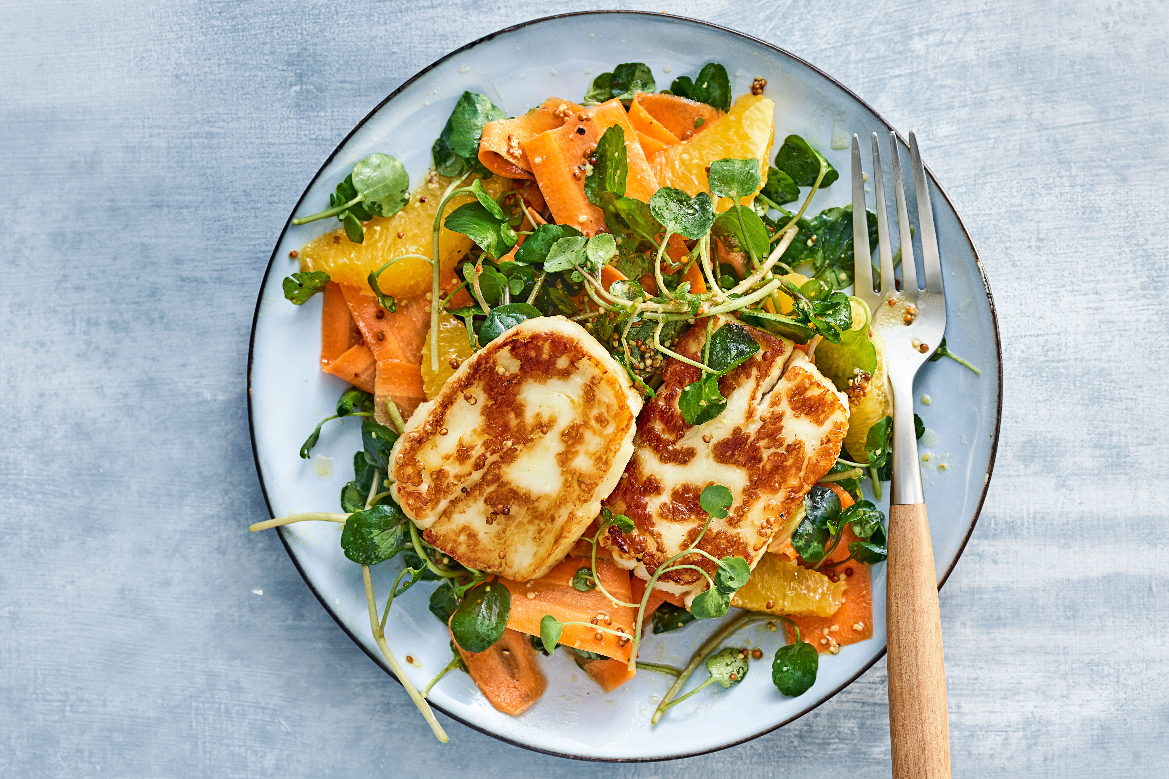 Halloumi, carrot & orange salad on a plate