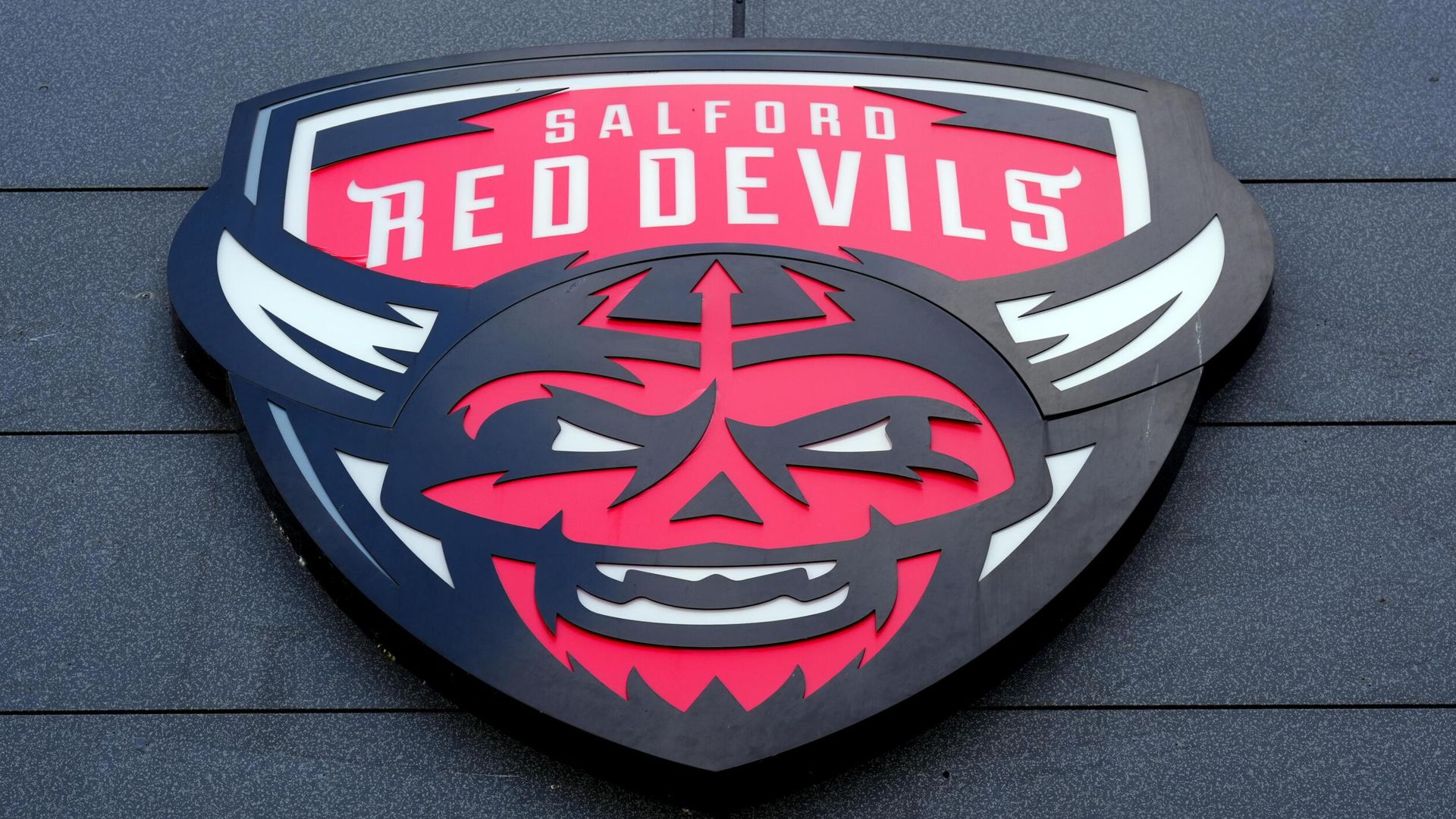 Salford Red Devils’ Financial Struggles Mirror Biblical Debt Crises, Raising Questions About Accountability and Future Survival in Professional Sports