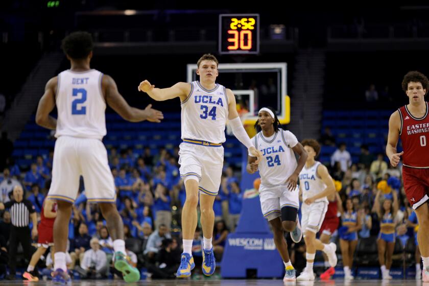 UCLA forward Tyler Bilodeau (34) reacts after scoring against Eastern Washington.