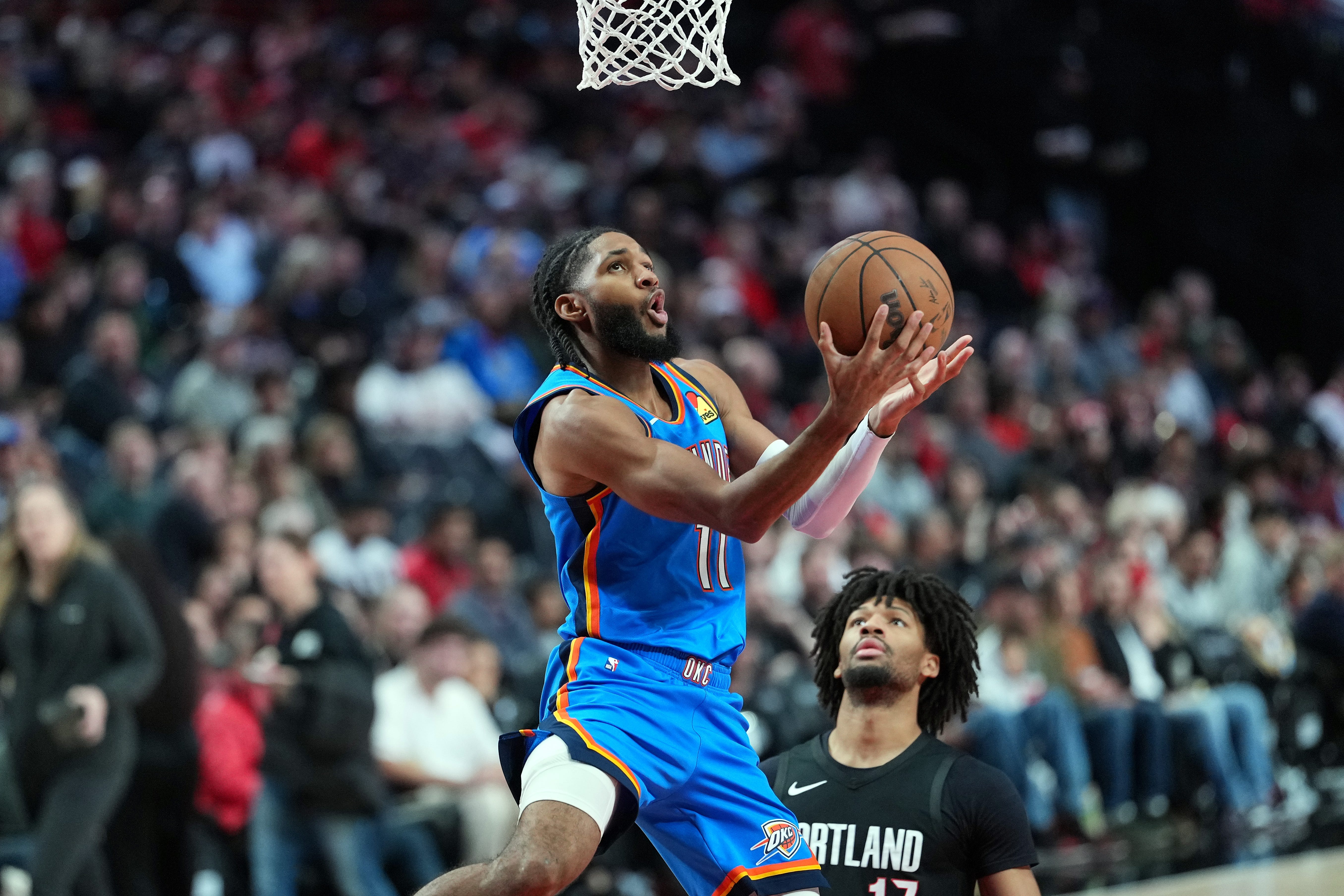 PORTLAND, OREGON - NOVEMBER 05: Isaiah Joe #11 of the Oklahoma City Thunder shoots past Shaedon Sharpe #17 of the Portland Trail Blazers during the second half at Moda Center on November 05, 2025 in Portland, Oregon. NOTE TO USER: User expressly acknowledges and agrees that, by downloading and or using this photograph, User is consenting to the terms and conditions of the Getty Images License Agreement. (Photo by Soobum Im/Getty Images)