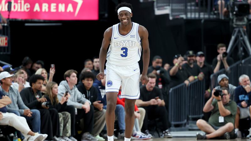 BYU forward AJ Dybantsa smiles after a play during the second half of an NCAA college basketball game against Villanova, Monday, Nov. 3, 2025, in Las Vegas. (AP Photo/Ian Maule)