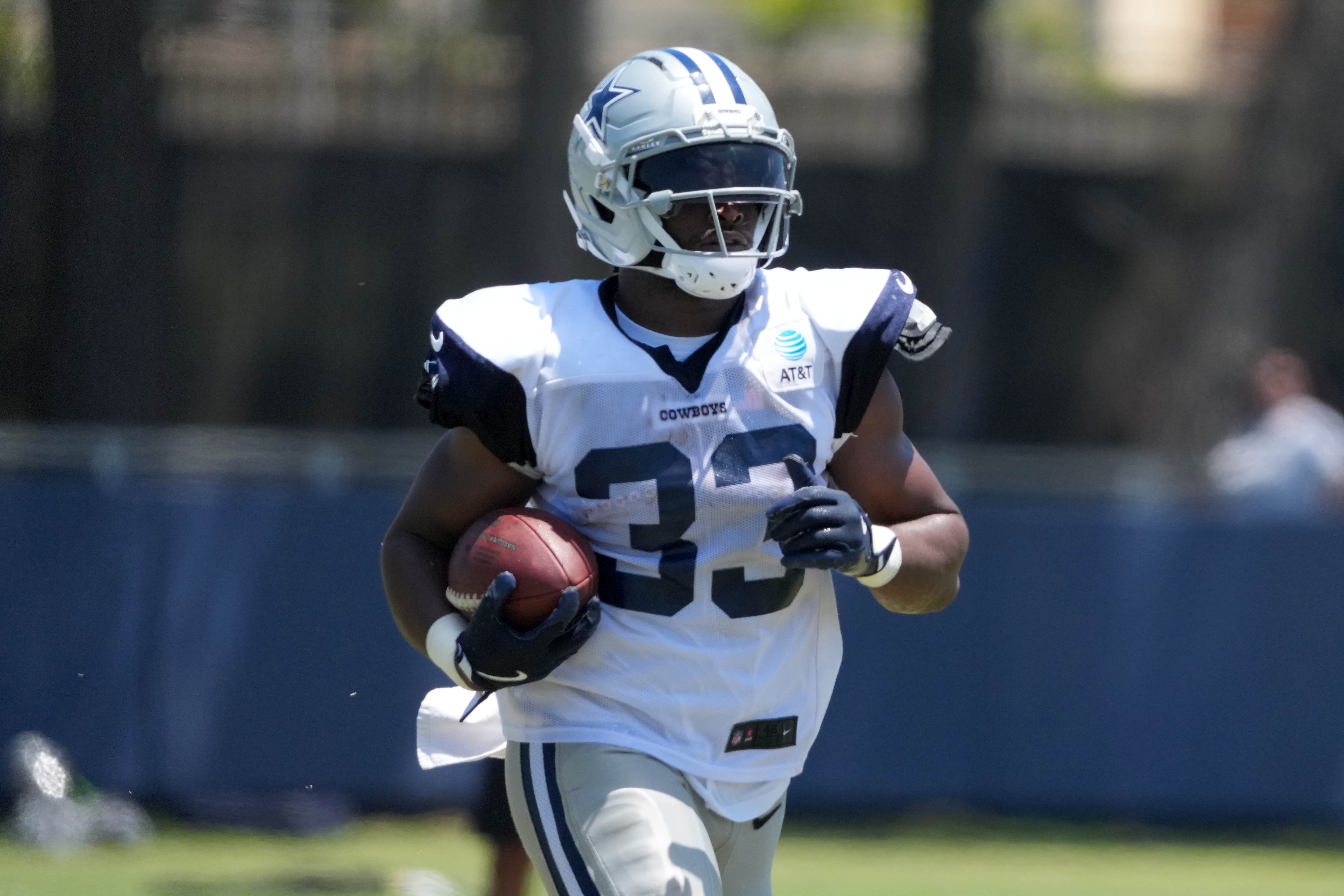 Jul 27, 2025; Oxnard, CA, USA; Dallas Cowboys running back Javonte Williams (33) carries the ball at training camp at the River Ridge Fields. Mandatory Credit: Kirby Lee-Imagn Images