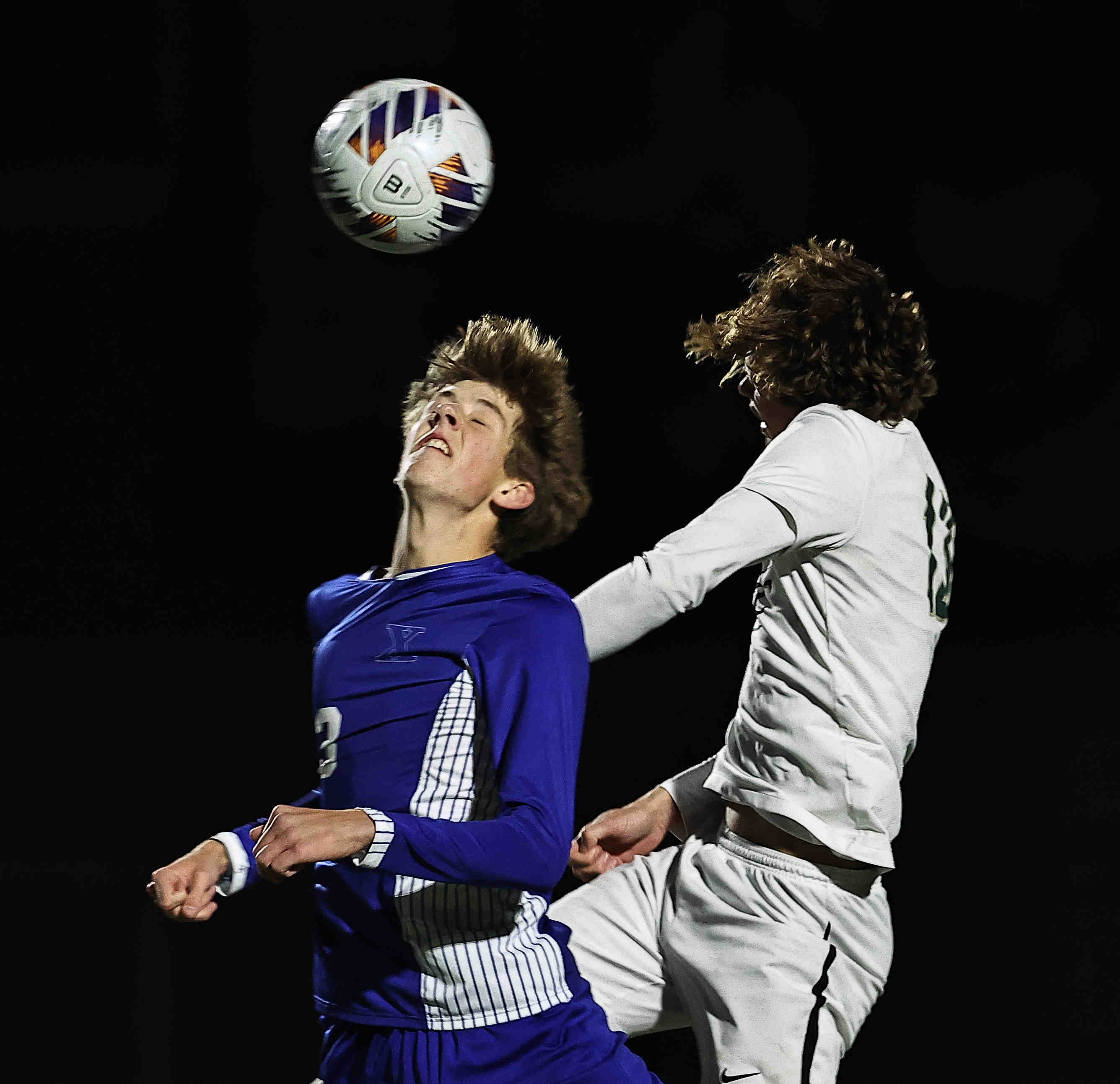 St. Xavier's Brian Bolan (3) battles Dublin Jerome's Nick Myers (13) for the ball during their OHSAA Division I state semifinal Wednesday, Nov. 5, 2025, at Springfield High School.