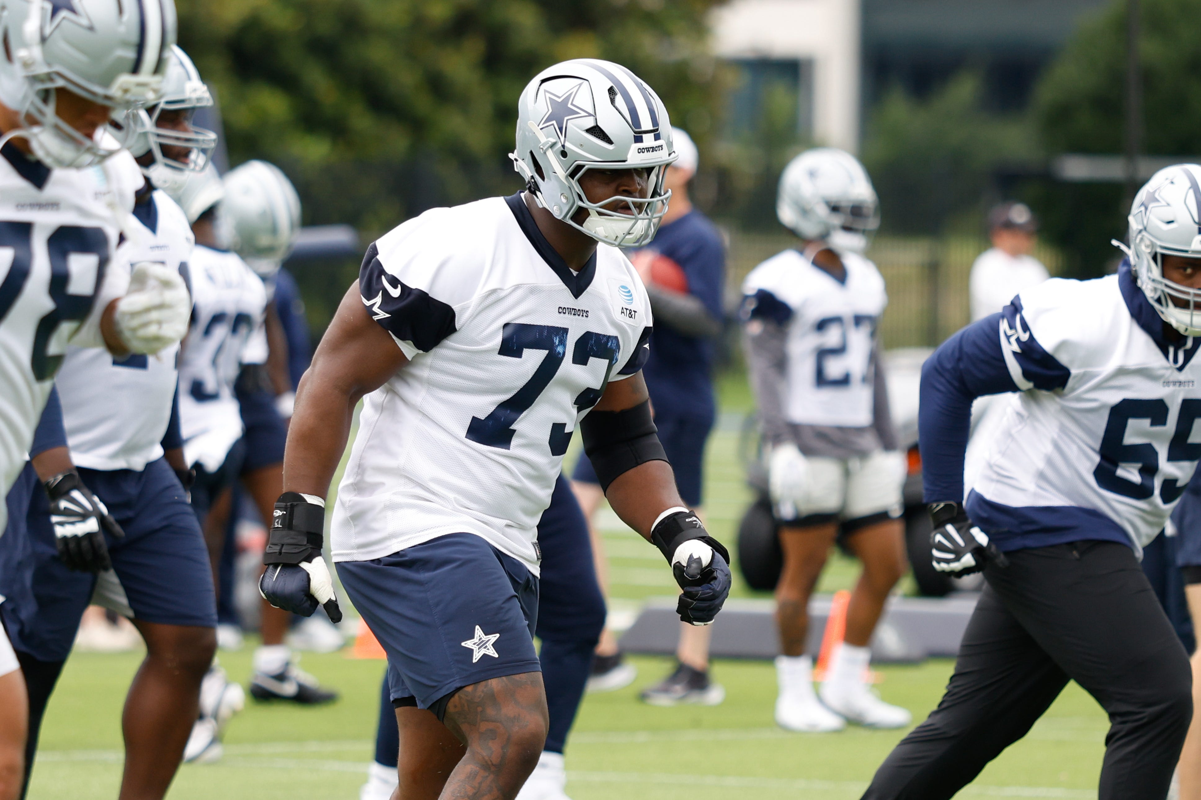 Jun 10, 2025; Arlington, TX, USA; Dallas Cowboys guard Tyler Smith (73) goes through a drill during practice at the Ford Center at the Star Training Facility in Frisco, Texas. Mandatory Credit: Chris Jones-Imagn Images