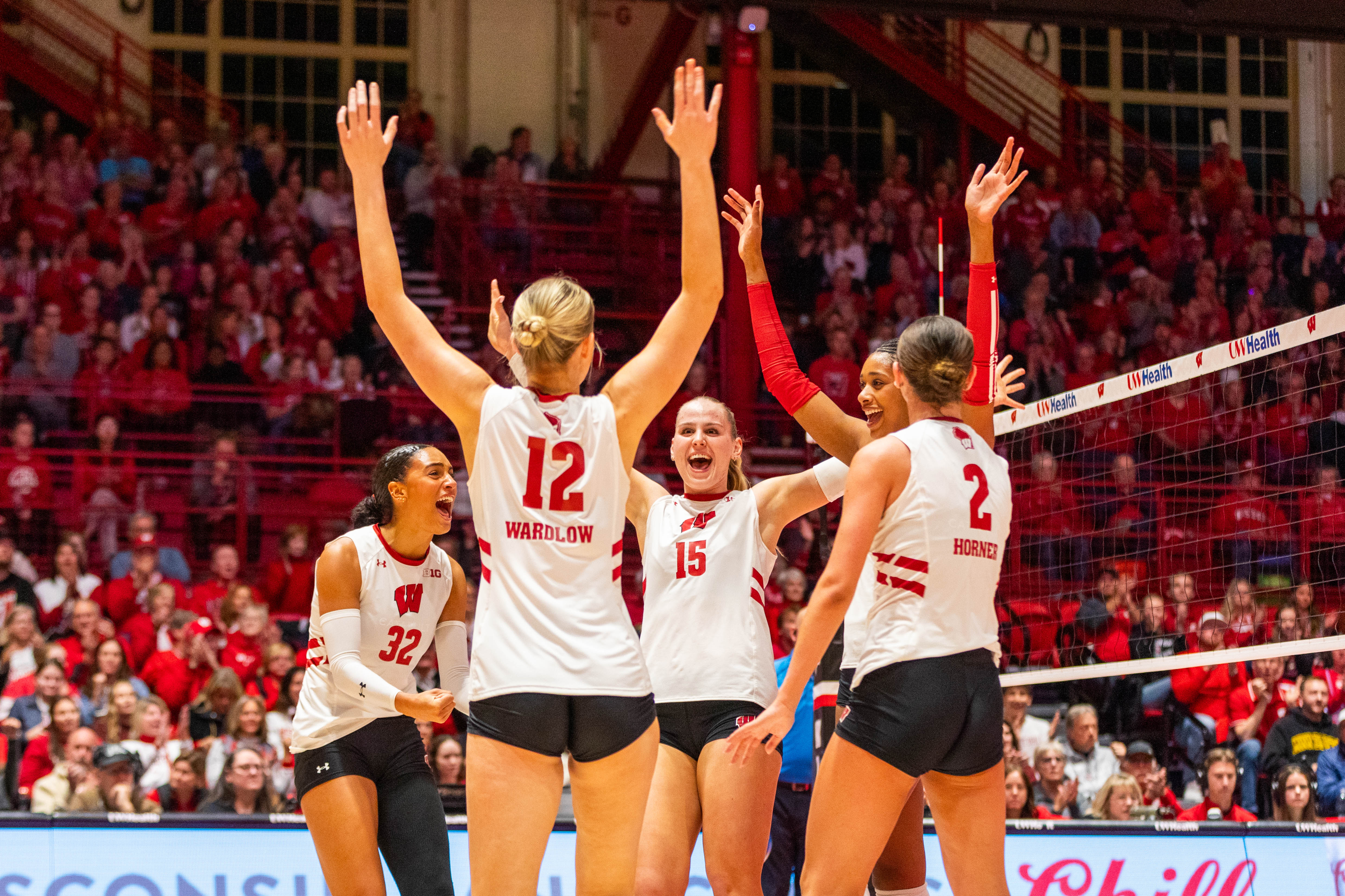 Wisconsin players celebrate a point during the first set of the Badgers' match against Minnesota at the UW Field House in Madison on Nov. 5, 2025.