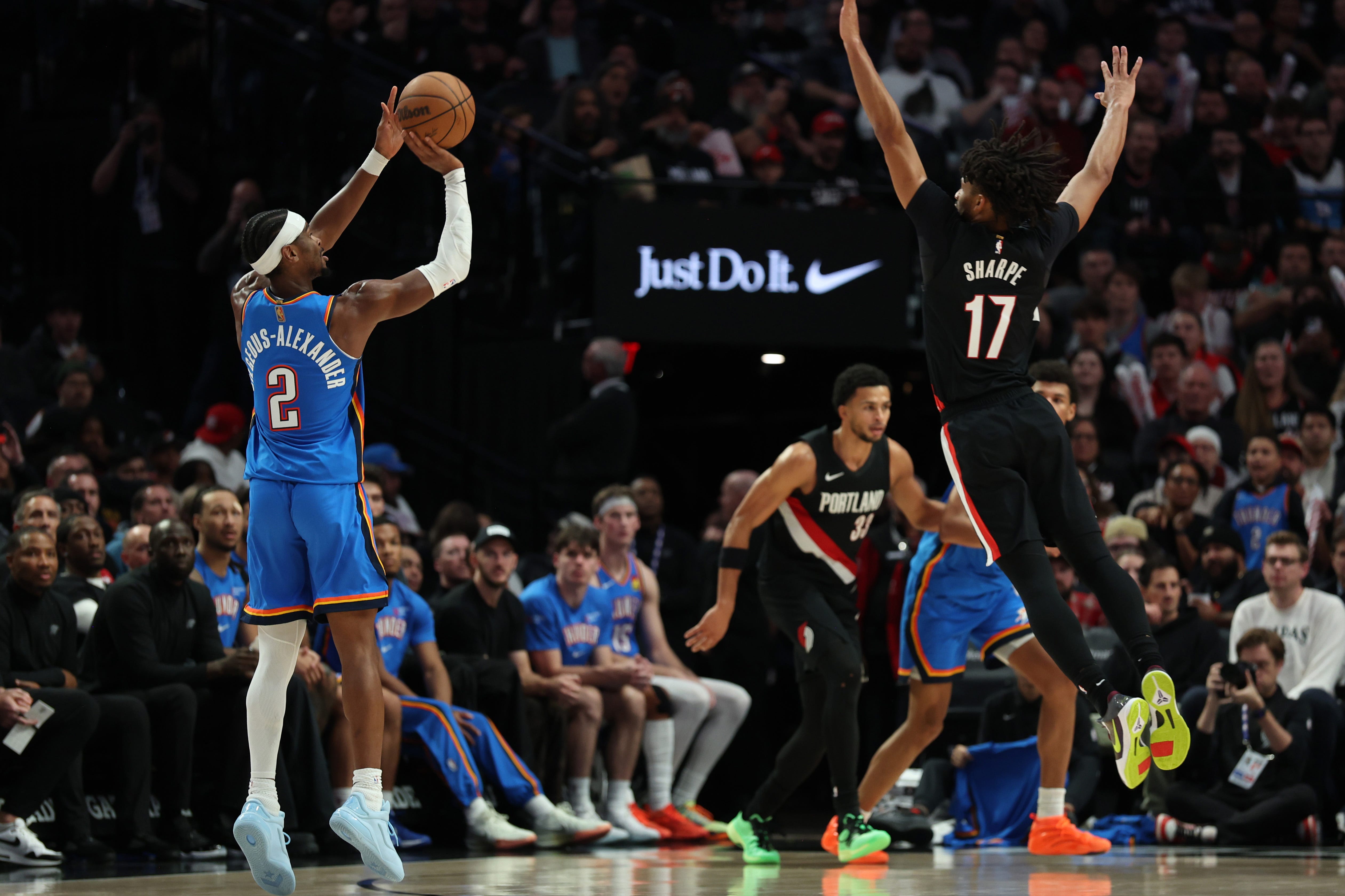 Nov 5, 2025; Portland, Oregon, USA; Oklahoma City Thunder guard Shai Gilgeous-Alexander (2) shoots the ball over Portland Trail Blazers guard Shaedon Sharpe (17) during the second half at Moda Center. Mandatory Credit: Jaime Valdez-Imagn Images