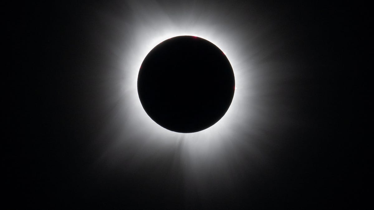 The Economics and Logistics of Total Solar Eclipses