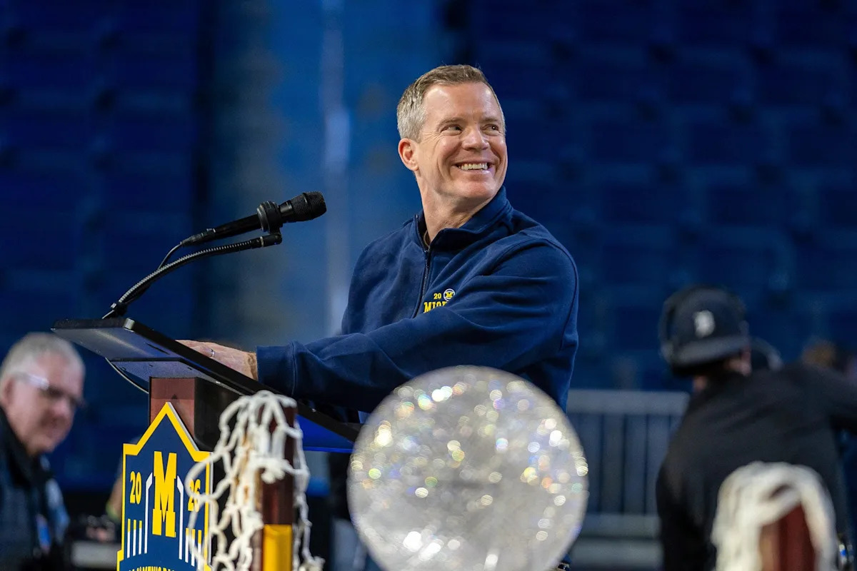 The Coaching Exodus: Dusty May and the Structural Erosion of Collegiate Basketball